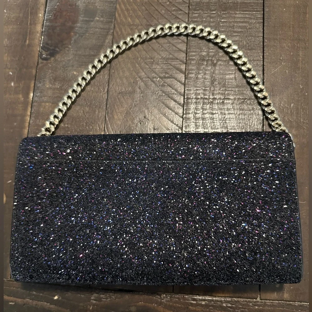 kate spade New York black w/multi colored glitter Milou Sunset Lane clutch.